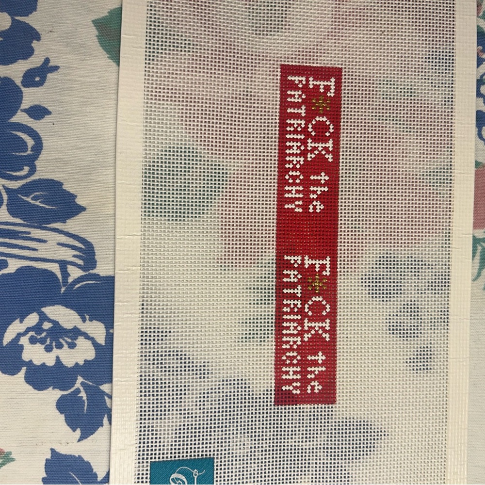 Needlepoint Canvas with Red and White Text